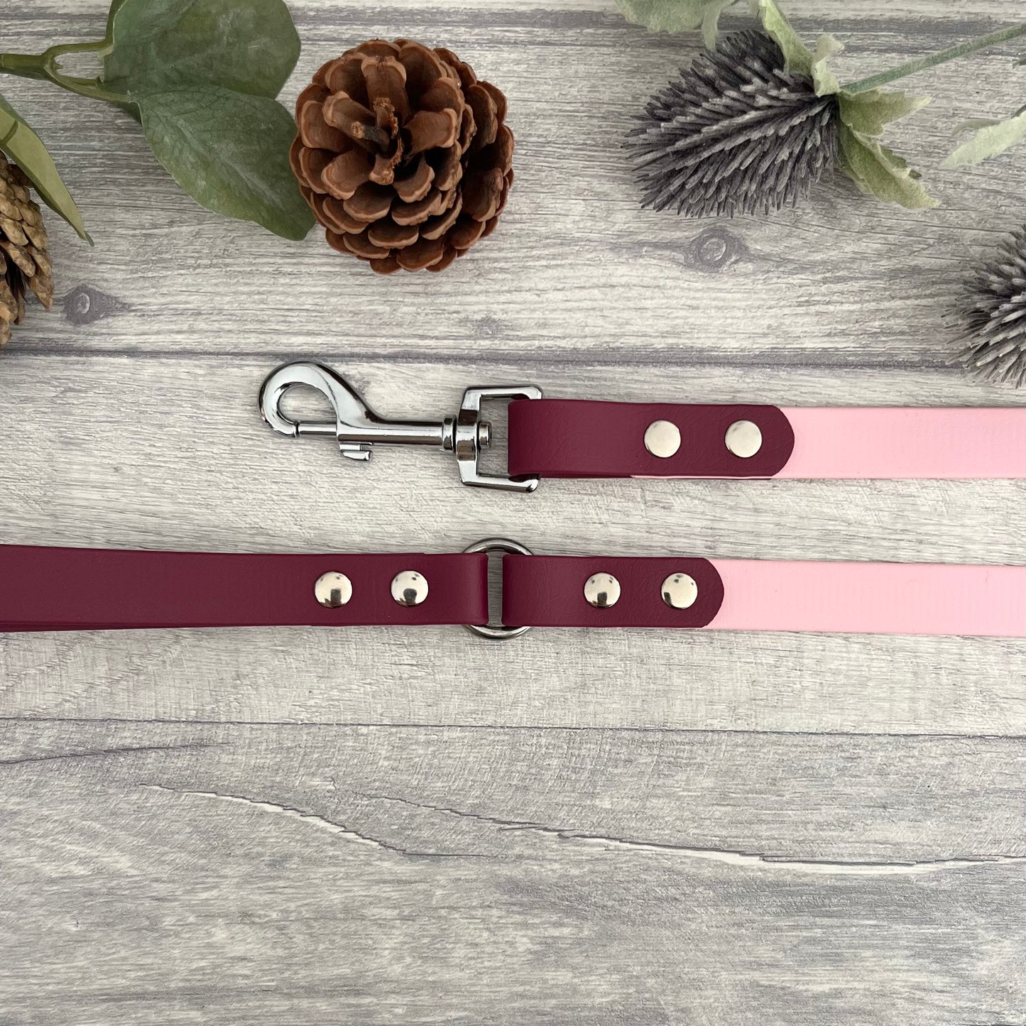 Two coloured Biothane dog lead. The handle and accent colour at the clip end of the lead is Wine Red, the mail lead colour is Light Pink giving the lead a two tone look. The hardware is Silver.