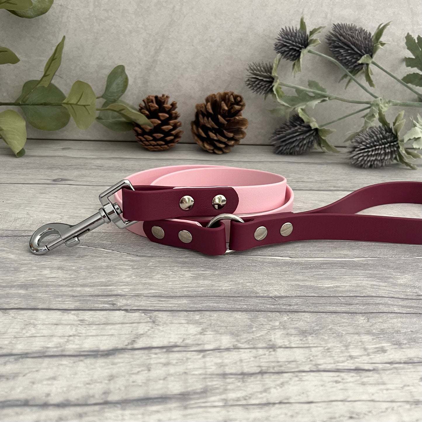Two coloured Biothane dog lead. The handle and accent colour at the clip end of the lead is Wine Red, the mail lead colour is Light Pink giving the lead a two tone look. The hardware is Silver.