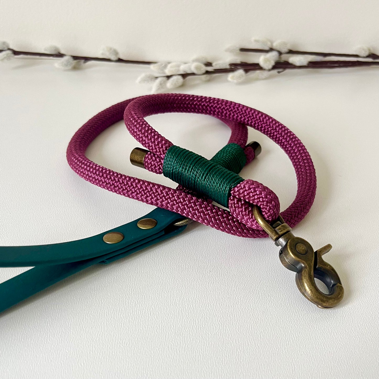 Dark Red rope dog lead with a dark green BioThane handle and binding a with antique brass hardware