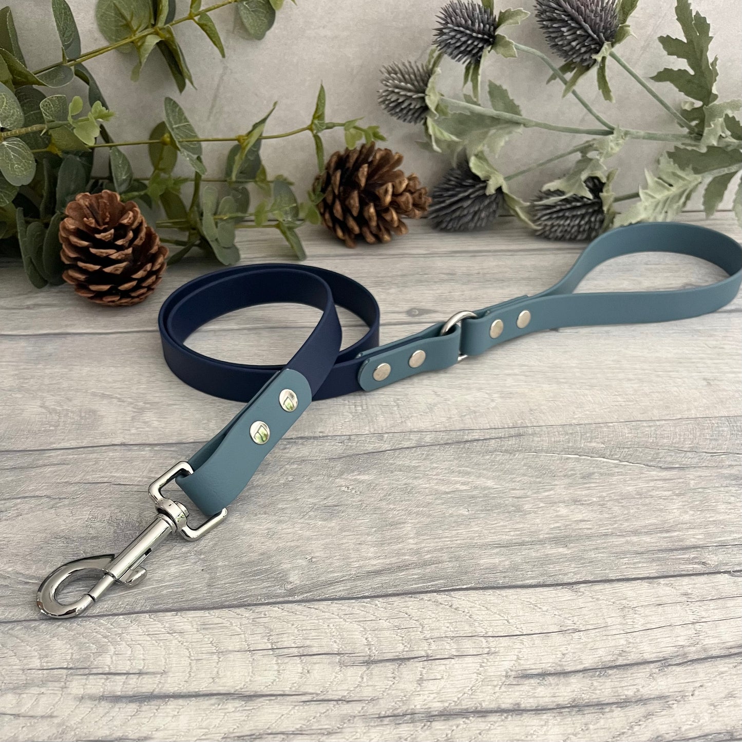 Two coloured Biothane dog lead. The handle and accent colour at the clip end of the lead is Petrol Blue, the mail lead colour is Navy giving the lead a two tone look. The hardware is Silver.