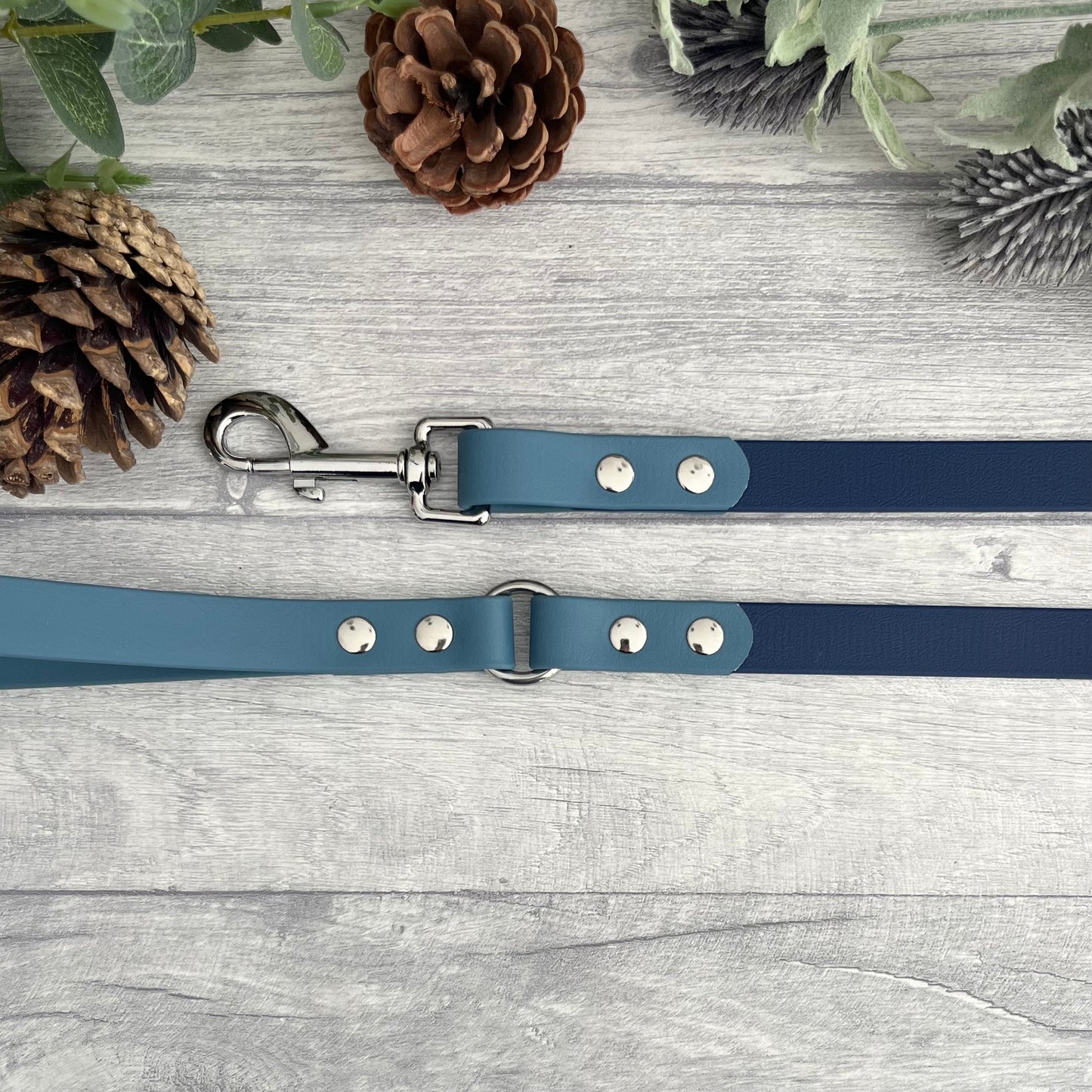 Two coloured Biothane dog lead. The handle and accent colour at the clip end of the lead is Petrol Blue, the mail lead colour is Navy giving the lead a two tone look. The hardware is Silver.