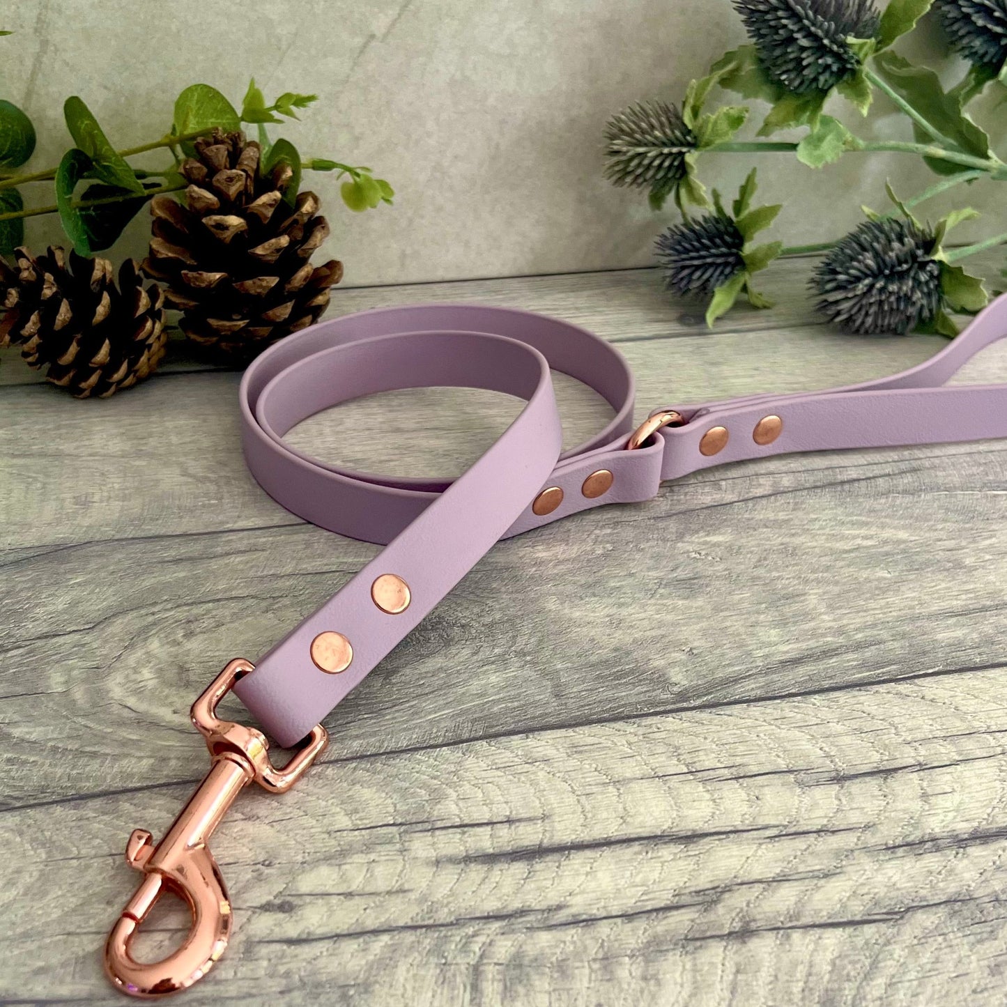 Lavender BioThane dog lead with Rose Gold hardware. The lead and handle are joined by an O-ring, each end is fixed with two rivets.