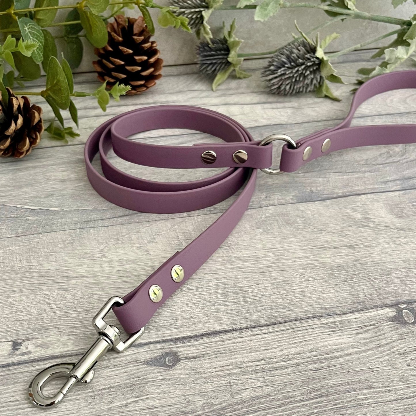 Mauve Biothane lead with Silver hardware. An O-ring connects the handle to the lead with double ended rivets fixing it together. A Snap Clip is fixed with double ended rivets. The lead has a soft leather appearance.