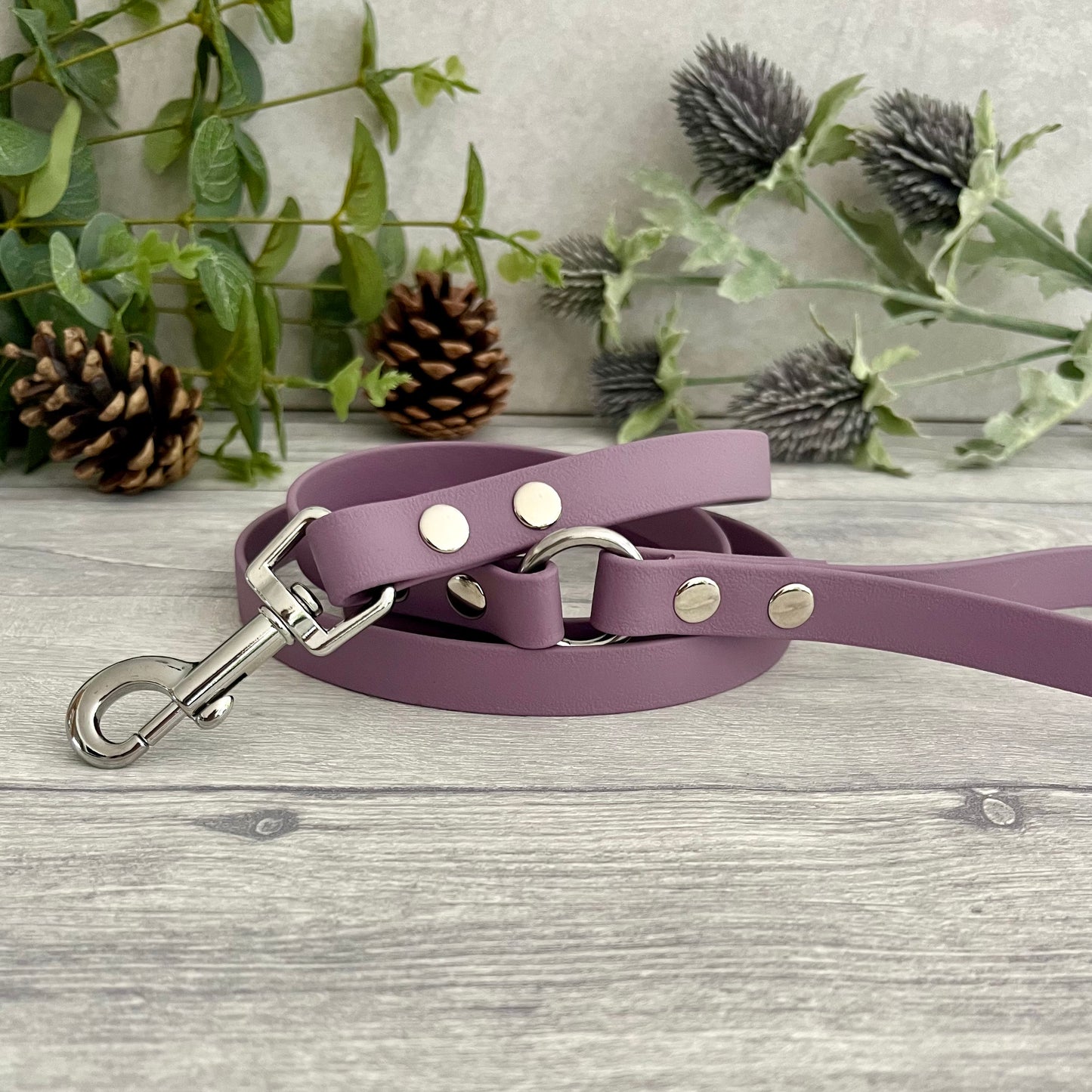 Mauve Biothane lead with Silver hardware. An O-ring connects the handle to the lead with double ended rivets fixing it together. A Snap Clip is fixed with double ended rivets. The lead has a soft leather appearance.