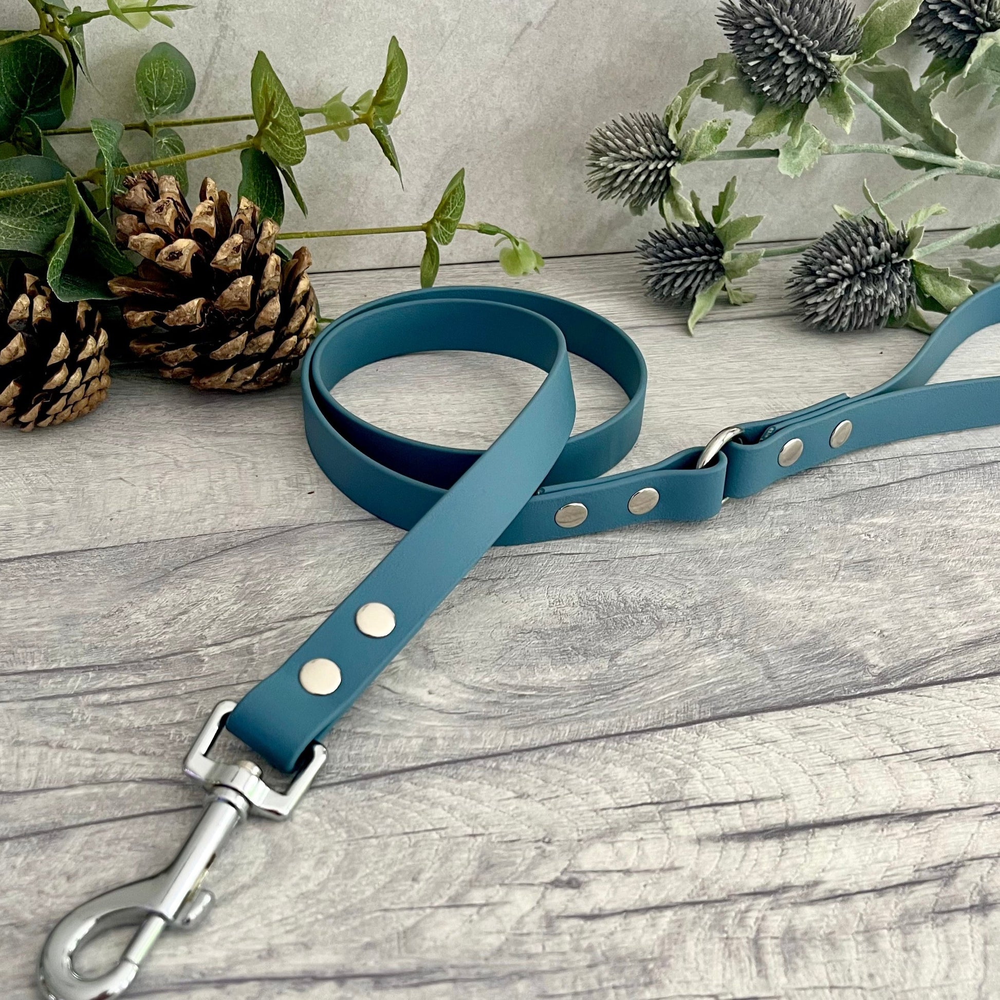 Petrol Blue BioThane dog lead with Silver hardware. The lead and handle are joined by an O-ring, each end is fixed with two rivets.