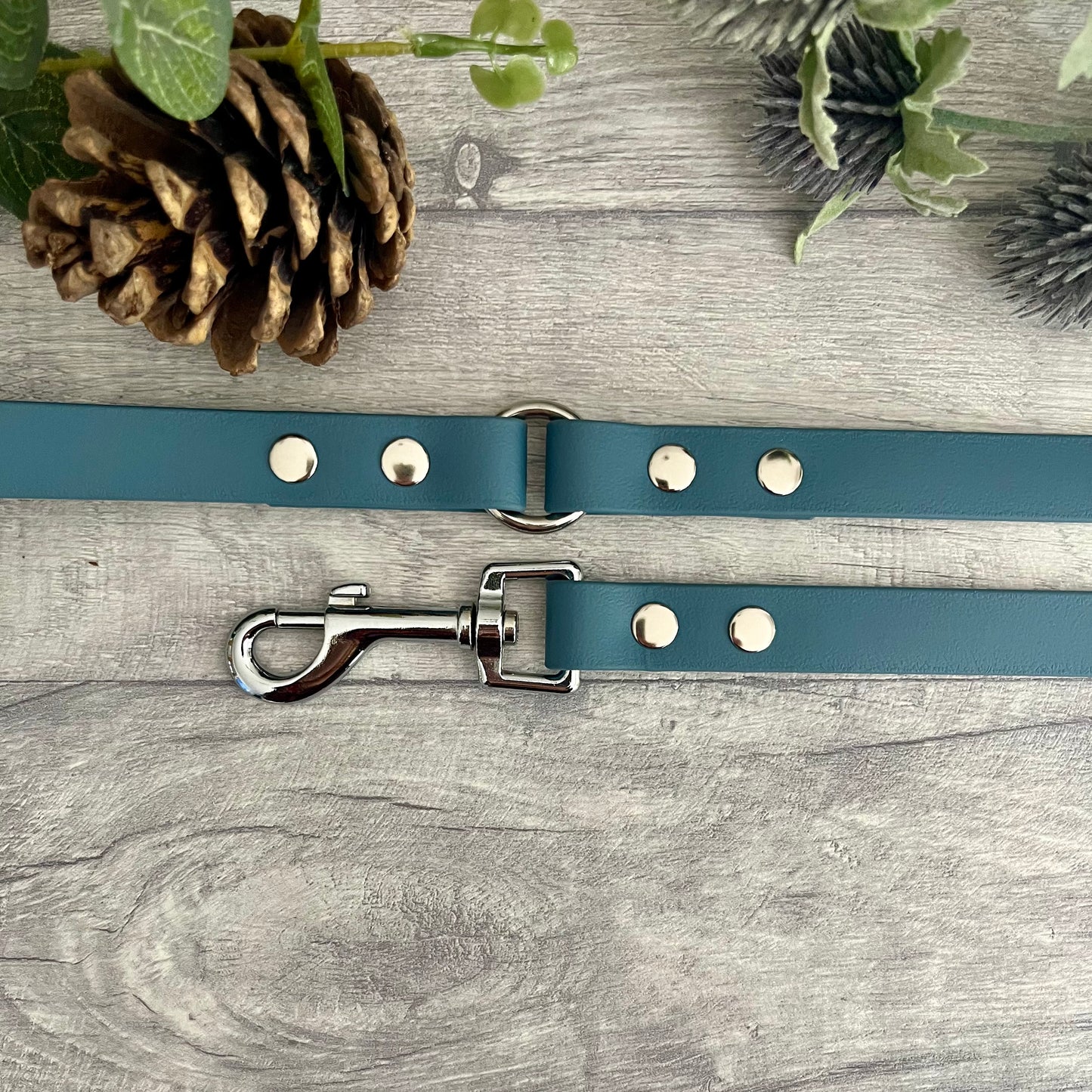 Petrol Blue BioThane dog lead with Silver hardware. The lead and handle are joined by an O-ring, each end is fixed with two rivets.