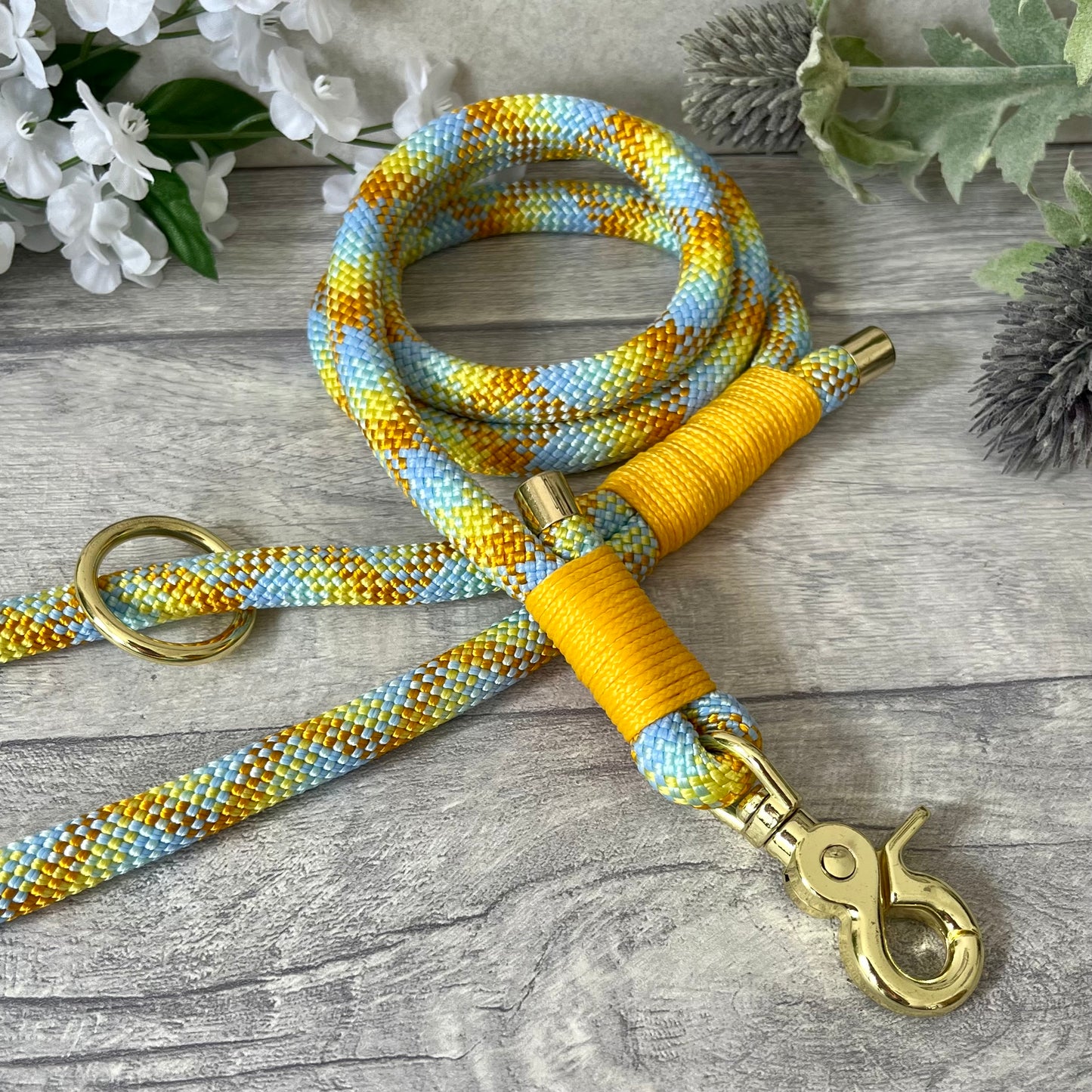 Miami Mix, Yellow rope lead with Honey whipping securing a swivel clip at one end and fastening a handle at the other. The handle has an O-ring attached. Each end of the rope is finished with a metal end cap. All hardware for this lead is in Gold