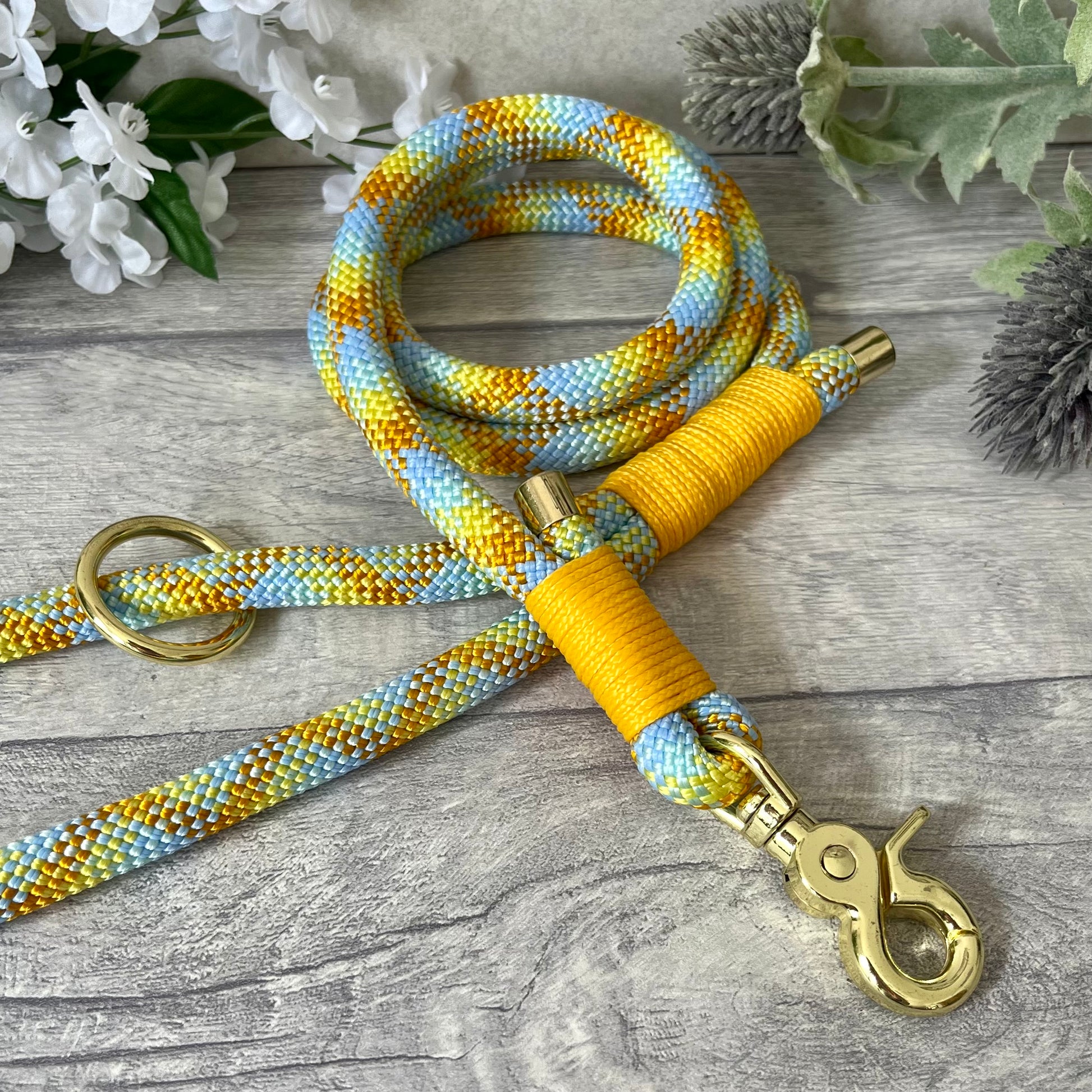 Miami Mix, Yellow rope lead with Honey whipping securing a swivel clip at one end and fastening a handle at the other. The handle has an O-ring attached. Each end of the rope is finished with a metal end cap. All hardware for this lead is in Gold