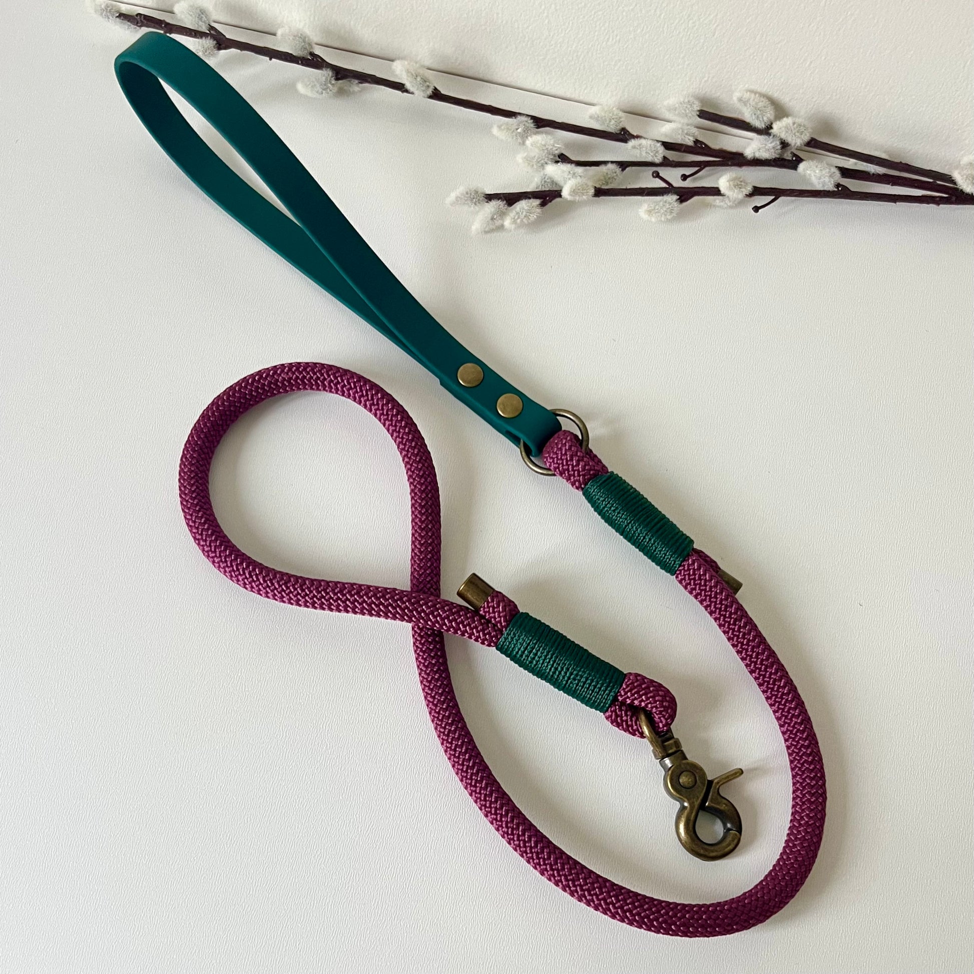 Dark Red rope dog lead with a dark green BioThane handle and binding a with antique brass hardware