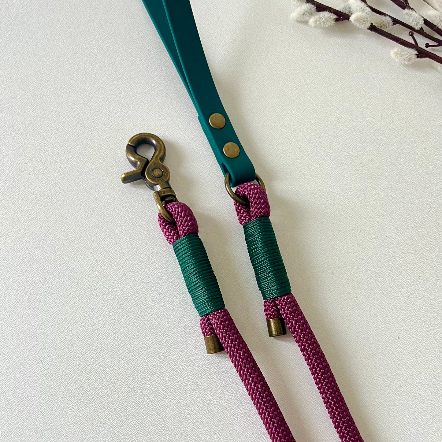 Dark Red rope dog lead with a dark green BioThane handle and binding a with antique brass hardware