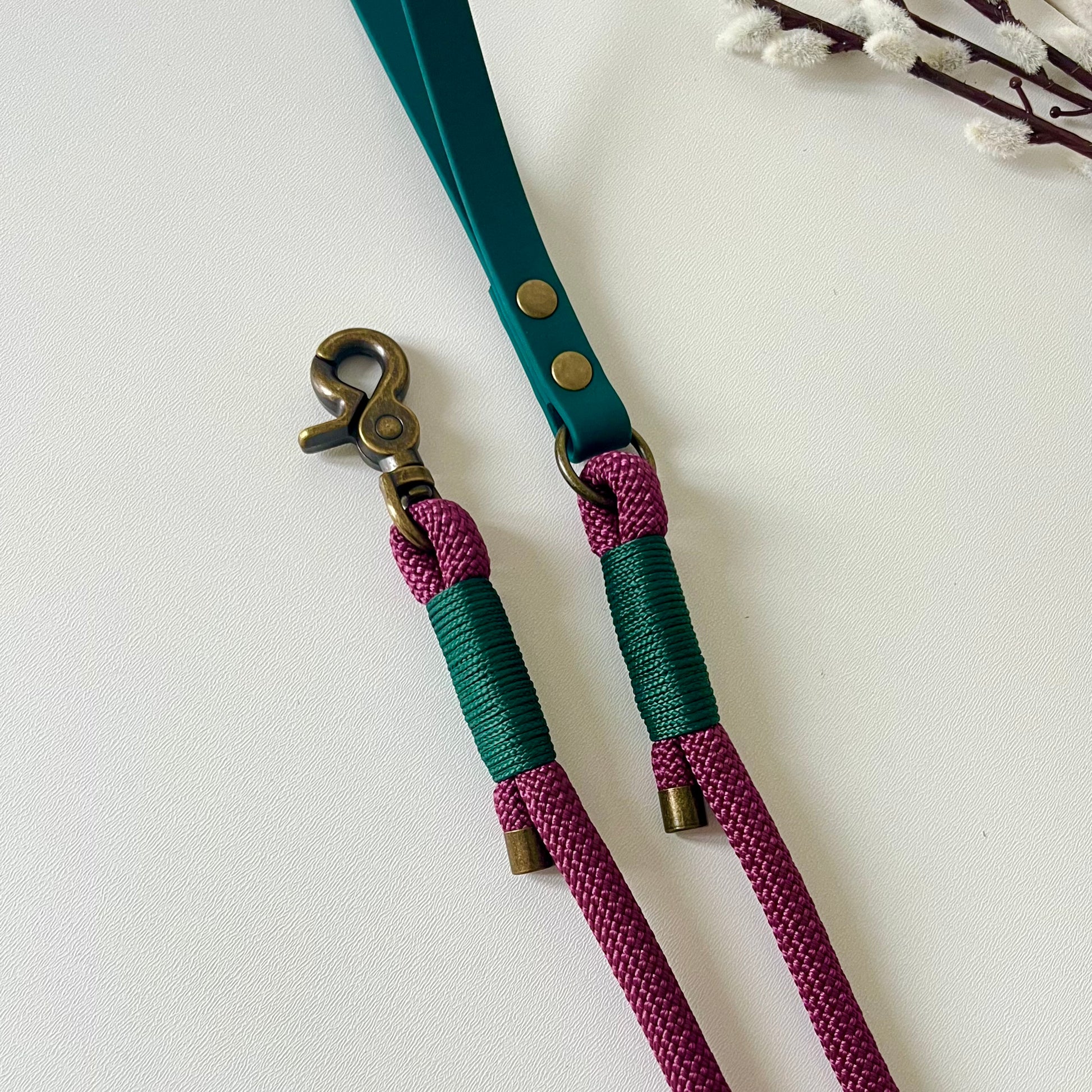 Dark Red rope dog lead with a dark green BioThane handle and binding a with antique brass hardware