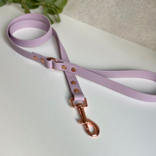 Lavender BioThane dog lead with Rose Gold hardware. The lead and handle are joined by an O-ring, each end is fixed with two rivets.