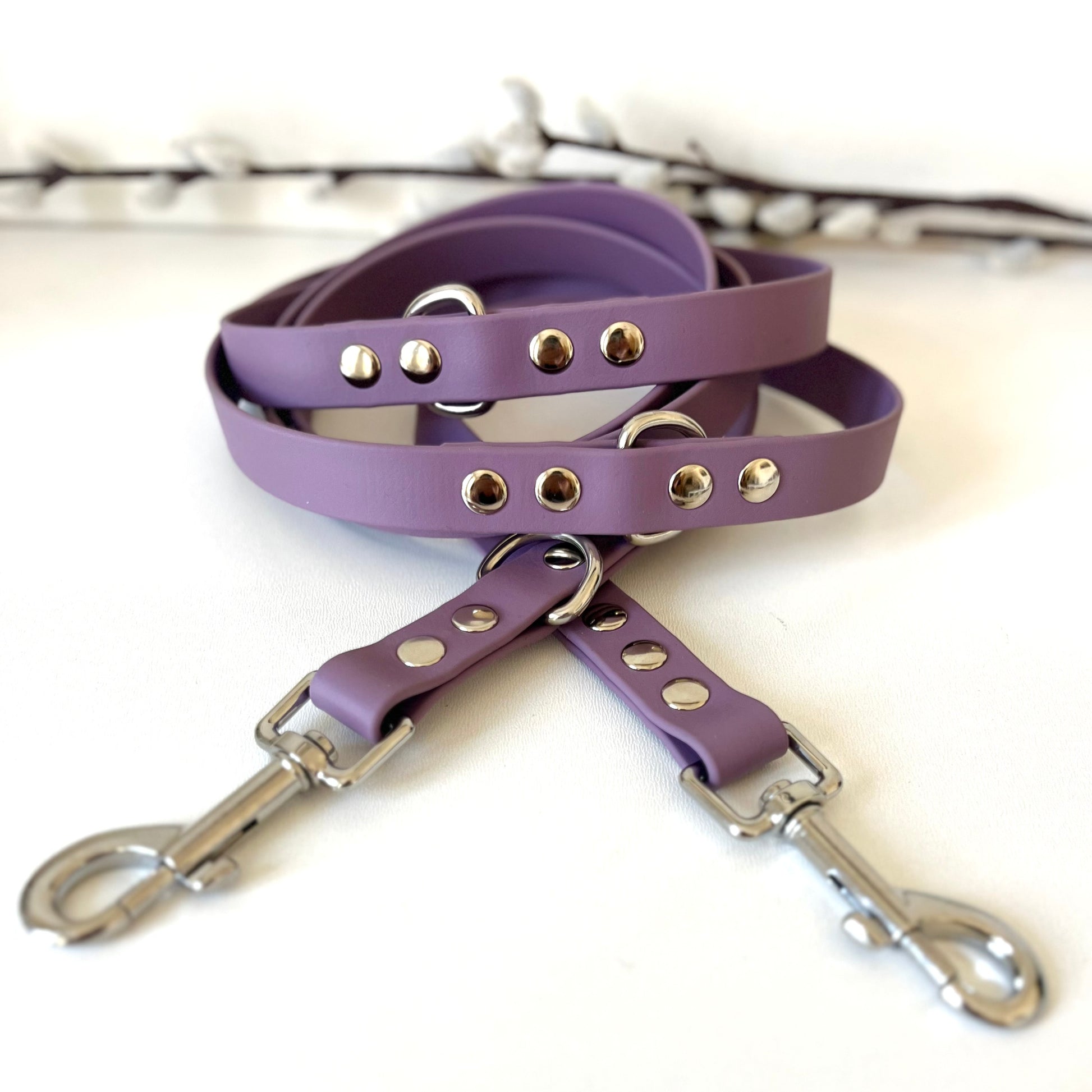 a mauve double ended Biothane dog lead with silver hardware
