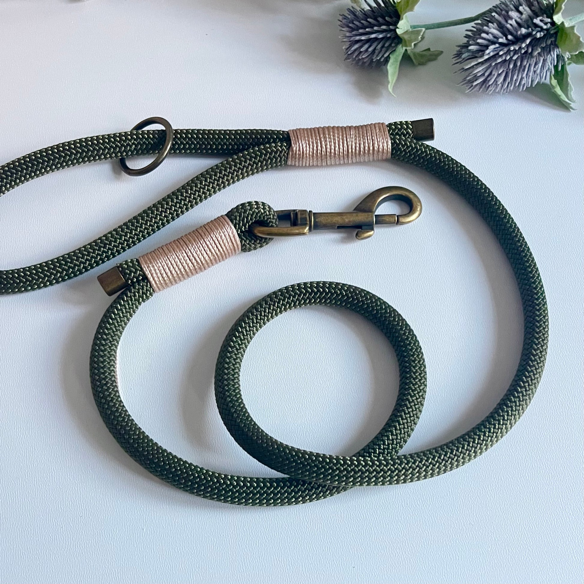 Olive green rope dog lead with antique brass hardware and beige whipping