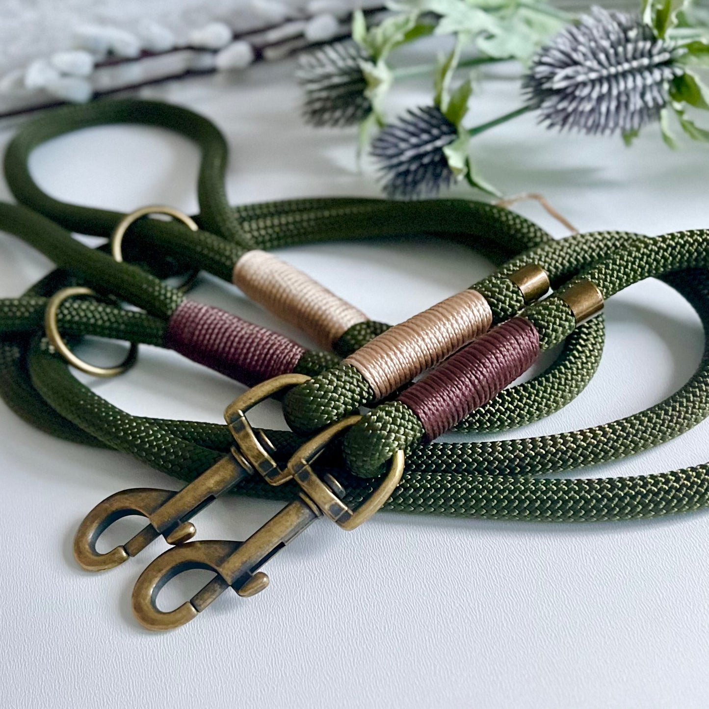 Two Olive green rope dog leads with antique brass hardware 

